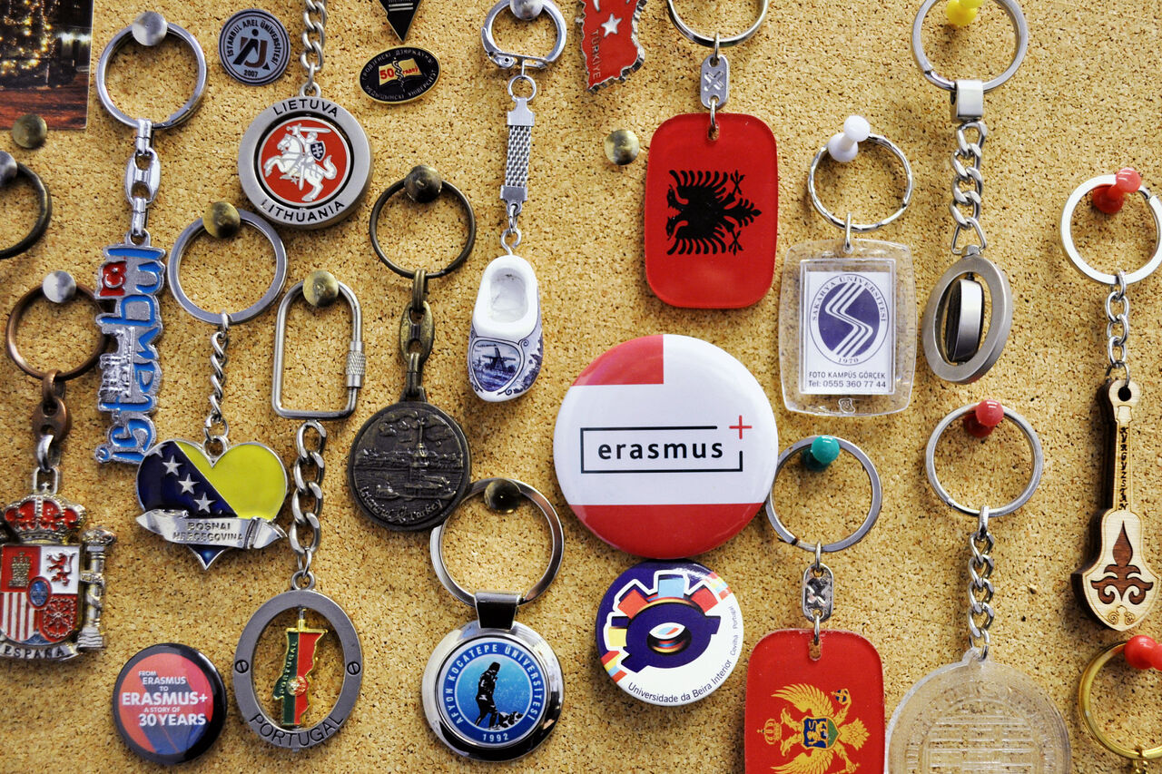 a set of magnets, keychains, and small gifts from all around the world